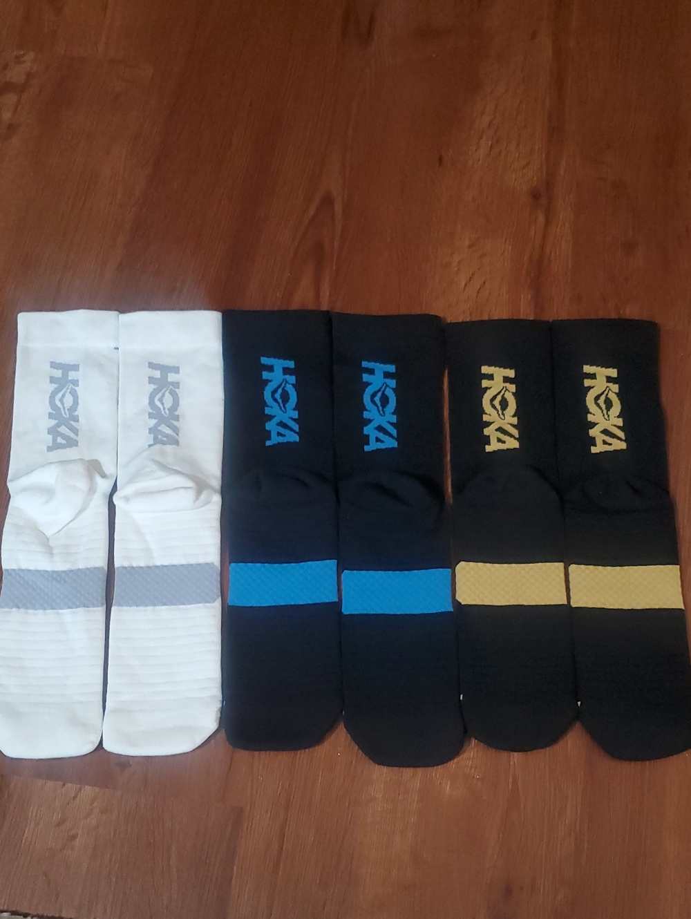 Hoka Compression Crew Athletic Socks in White, Black/Blue, Black/Gold – 3 Pack